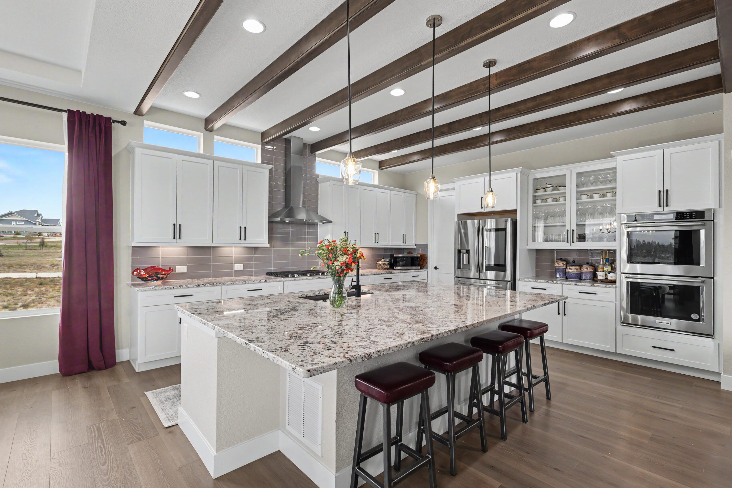 Luxury kitchen at 10003 Aspen Valley Rd Colorado Springs 80908 with large island, quartz countertops and VA assumable loan opportunity